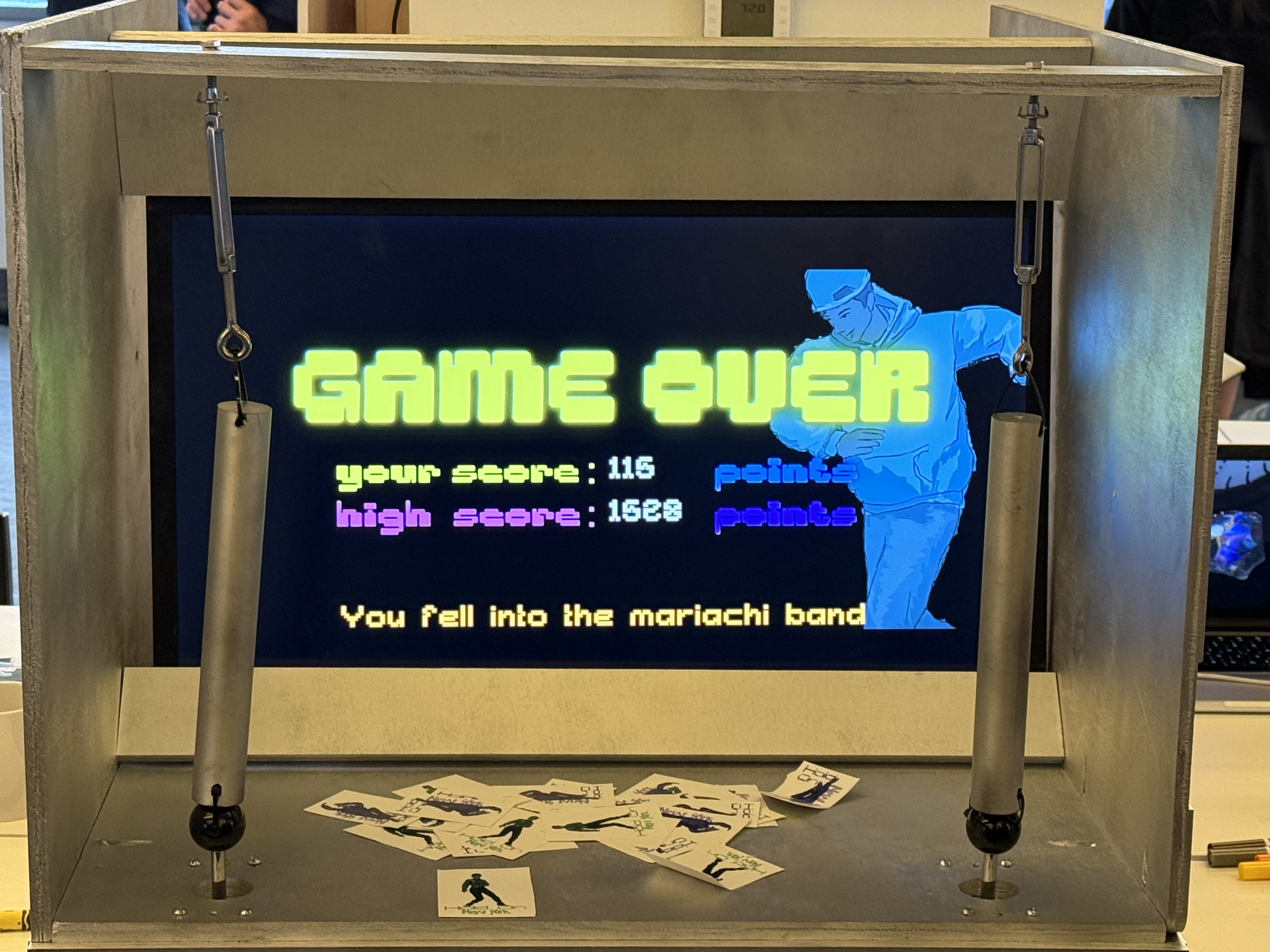 Game Over screen on the arcade cabinet with subway poles visible and stickers scattered below